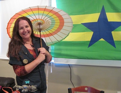 Sherry R in Kaylee cosplay, with parasol