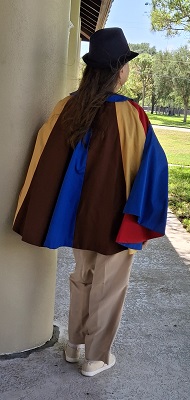 Sherry R cosplaying as Village person from The Prisoner, back view