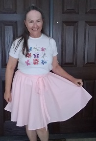 Sherry R modeling light pink adjustable-waist skirt