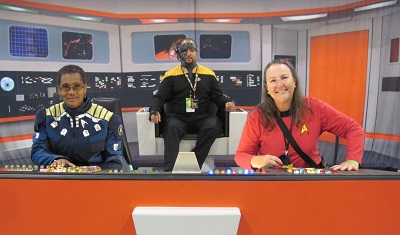 Sherry R cosplay in diy Star Trek TOS red shirt bridge photo op